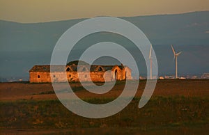 Wind turbines near at farmhouse