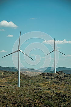 Wind turbines over hilly landscape