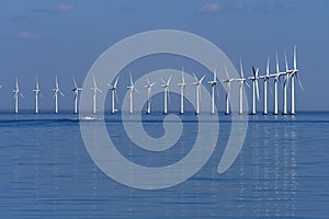 Wind turbines park in danish water in sea of Denmark