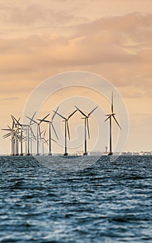 Wind turbines power generator farm along coast sea