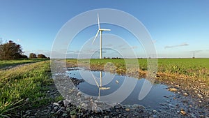 Wind turbines that produce electricity energy. Windmill wind power technology productions wind turbines in field