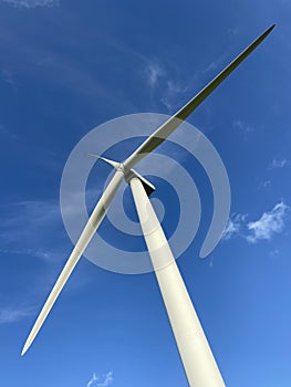 Wind turbines that produce electricity energy. Windmill Wind power technology productions Wind turbines in field