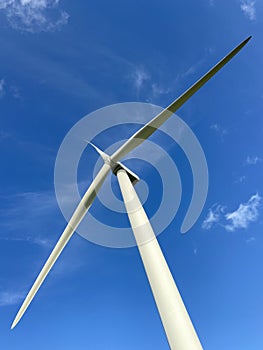 Wind turbines that produce electricity energy. Windmill Wind power technology productions Wind turbines in field