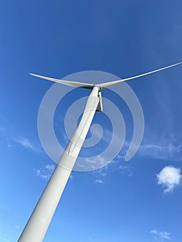 Wind turbines that produce electricity energy. Windmill Wind power technology productions Wind turbines in field