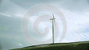 wind turbines produce energy in the green field, modern power plant, alternative energy sources