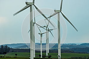 Wind turbines in a renewable energy wind farm early in the morning. In Schleswig Holstein Germany