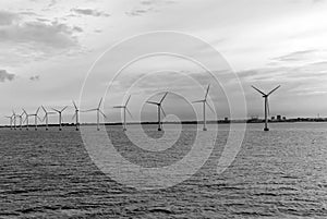 Wind turbines in sea in Copenhagen, Denmark. Offshore wind farm for renewable sustainable and alternative energy