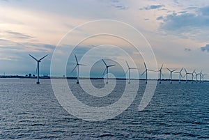 Wind turbines in sea in Copenhagen, Denmark. Offshore wind farm for renewable sustainable and alternative energy