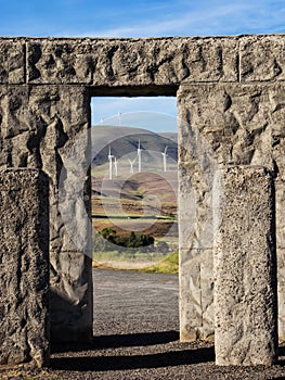 Wind turbines seen through stone door way