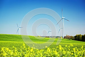 Wind turbines on spring field. Natural energy