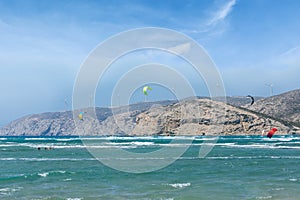 Wind turbines stand on top of a mountain near Cape Prasonisi on the island of Rhodes in Greece.