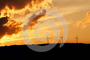 Wind turbines at sunset