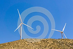 Wind turbines on the top of golden hills in Kern county, south California