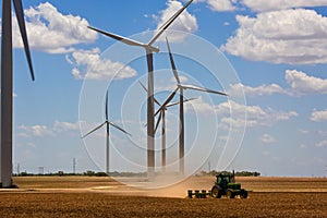 Wind turbines and a tractor