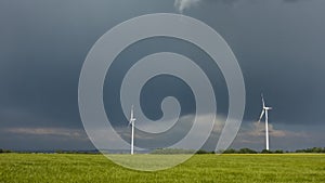 Wind turbines under a partly cloudy sky