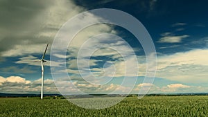 Wind Turbines under a partly cloudy sky