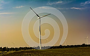 Wind Turbines on warm sky background