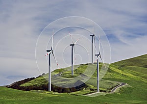 Wind turbines at a wind farm on a hill