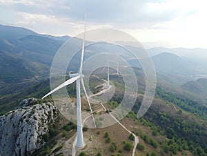 Wind turbines, Wind farm or wind park with turbines located on the mountains