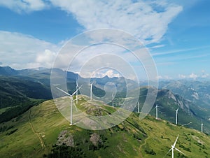 Wind turbines, Wind farm or wind park with turbines located on the mountains