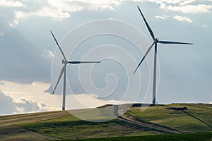 Wind turbines or windmills in the rolling farm fields of the Palouse in Washington State