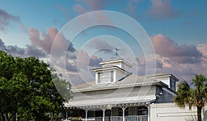 Wind Vane on Dormer of Tin Roof