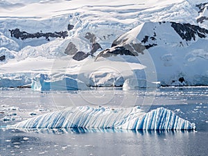 Wind and water sculpted iceberg drifting in Andvord Bay near Neko Harbor, Antarctic Peninsula, Antarctica