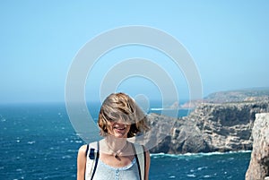 The wind on the woman`s hair, in front of the Atlantic ocean photo