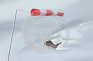 Windbag and snowed-in mountain hut in the Alps. Allgaeu, Germany.