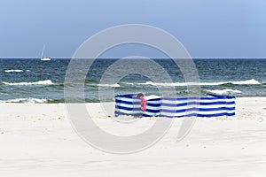 Windbreak on a wide golden beach at the Polish seaside photo