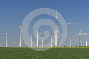 Windfarm with blue sky green energy