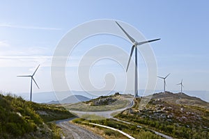 Windfarm with offroad access trail photo