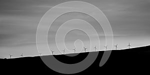 Windfarm in Scotland - a line of wind turbines on a hill on Isle of Skye