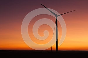 Windfarm at sunset and sky with dust from volcano