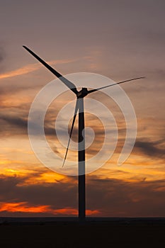 Windfarm at sunset and sky with dust from volcano