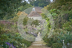 Winding garden path  leading to a dovecote