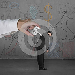 Winding money winder on man with business doodles background