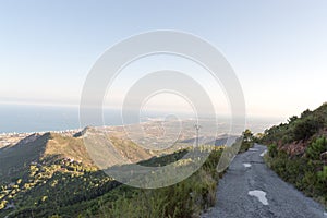 Winding mountain road with beautiful views of the valley and the sea