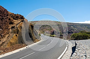 Winding mountain road and beautiful volcanic landscapes. Teide National Park, Tenerife, Canary Islands, Spain