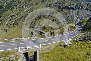 Winding mountain road with dangerous curves in Carpathian mountains. Transfagarasan road in Romania