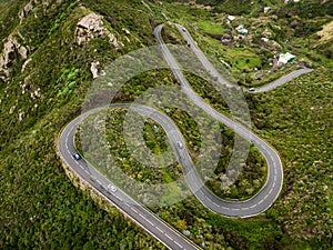 Winding mountain road on the green part of Tenerife island, Spain. Top aerial view.