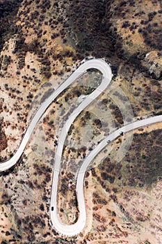 Winding mountain road, serpentine, top view. Aerial photography. Mountain landscape.