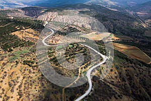 Winding mountain road, serpentine, top view. Aerial photography. Mountain landscape.