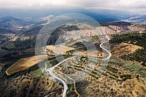 Winding mountain road, serpentine, top view. Aerial photography. Mountain landscape.