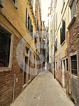Winding, narrow side street in Venice, Italy