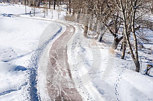 Winding Path Cleared of Snow on a Sunny Winter Day