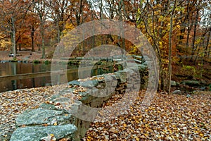 Winding path contours Lake flowing under foot bridge