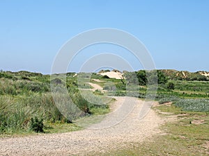 Winding path through sand dunes and grass on the merseyside coast near formby