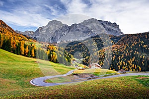 Winding road at the autumn Dolomite Alps