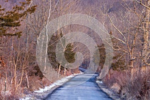 Winding road through barren landscape in late winter